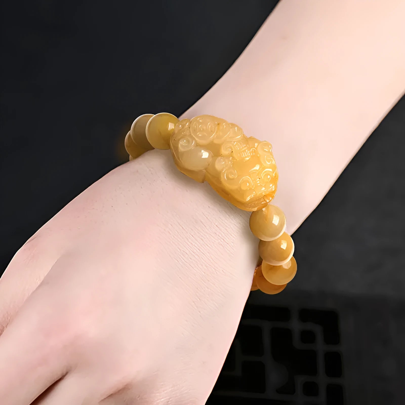 Hand-carved Jinsi Jade money bracelet with golden thread patterns, showing large and small size options for unisex wear