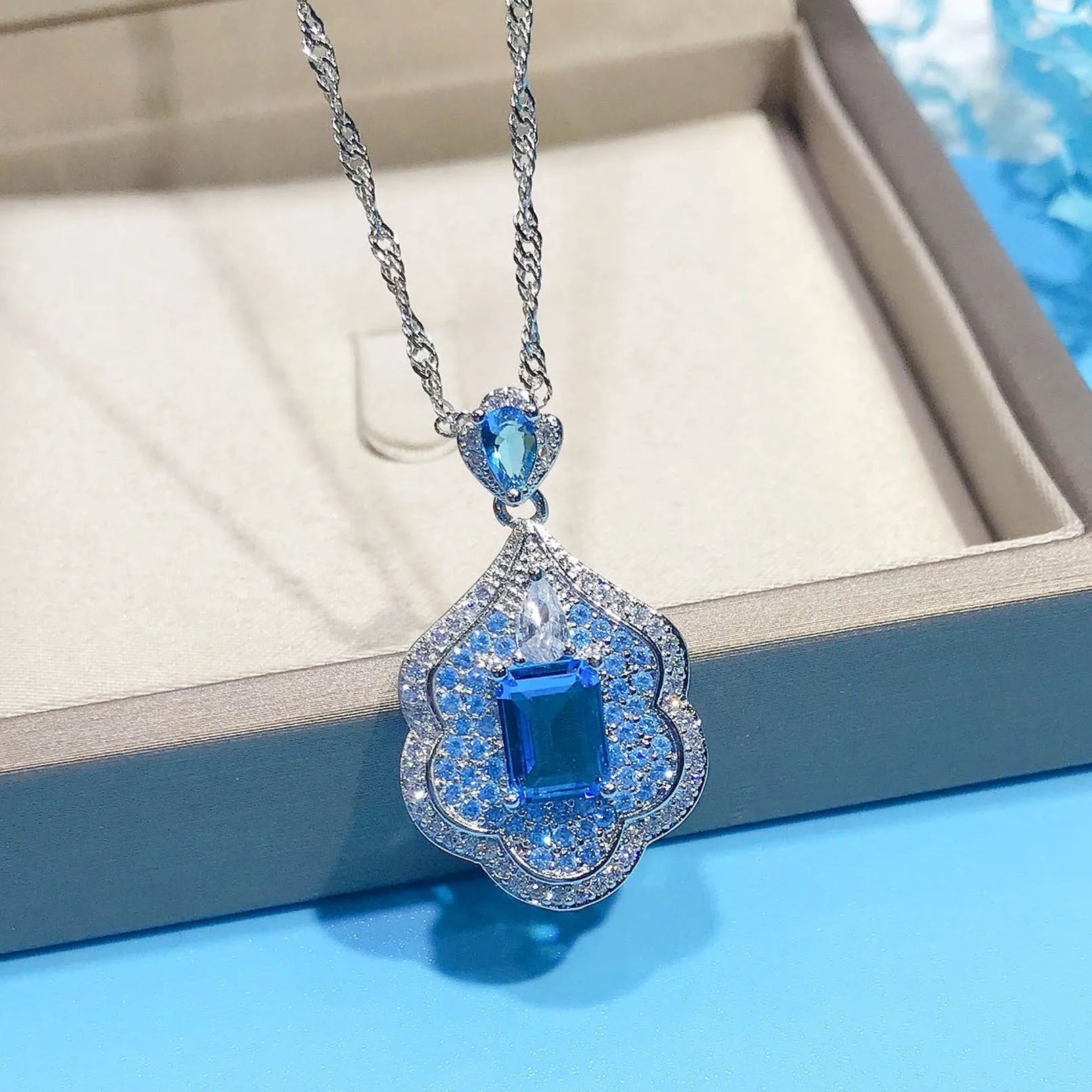 Sea blue geometric copper pendant charm with aquamarine topaz colour for DIY jewellery