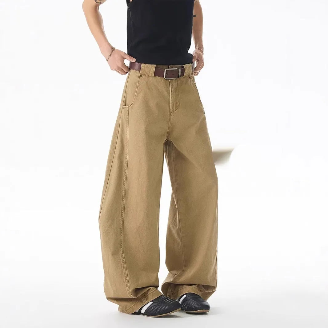 Men's brown straight-leg jeans with micro-elasticity, button-fly opening, and mid-waist design