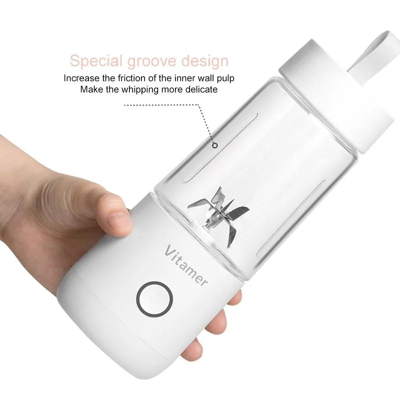 White portable USB rechargeable blender with 350ml cup and silicone handle on a table.