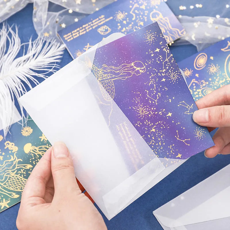 Set of three girly style bronzing mermaid greeting card envelopes on sulfuric acid paper.