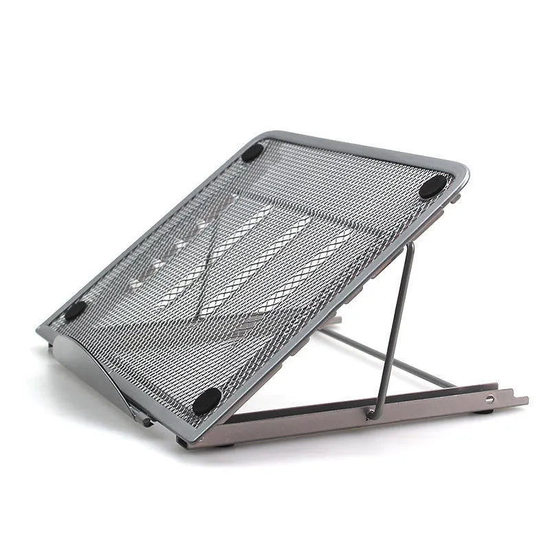 Folded metal laptop stand in silver colour showing slim 1.5cm profile next to a laptop.