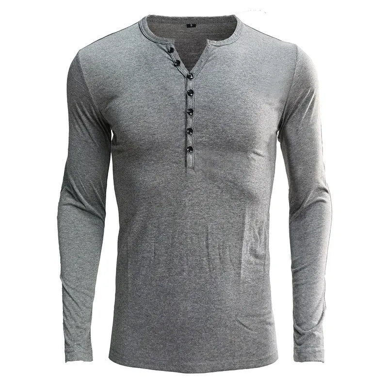 Men's long sleeved blue Henry collar pullover shirt laid flat, showing cotton blend fabric texture.