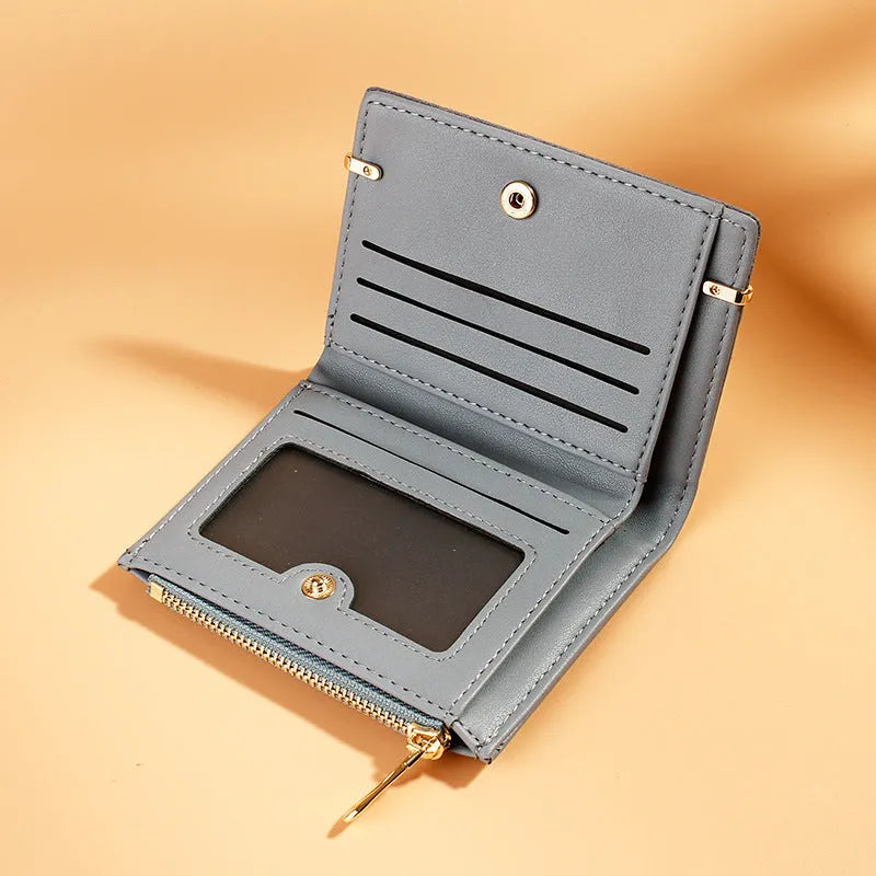 Black ladies wallet showing six internal compartments including photo slot, zipper section, card slots, and hidden compartment