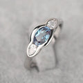 Geometric ellipse copper ring with zircon inlay, white gold colour finish, shown in size options 6-10