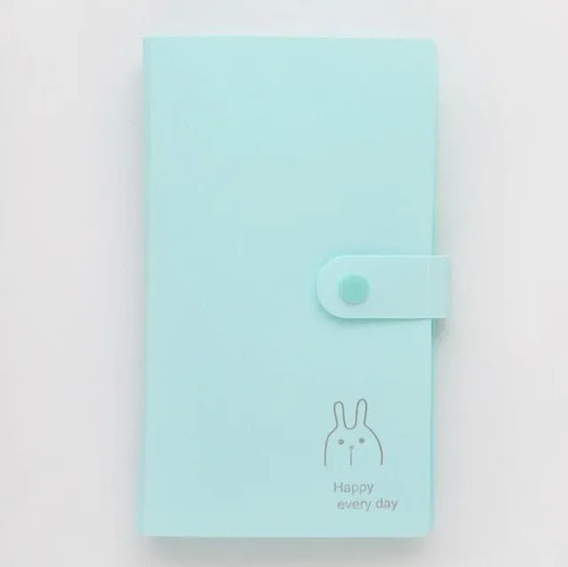 Blue PVC and PP business card holder book with protective shell showing insert pockets and smile logo.