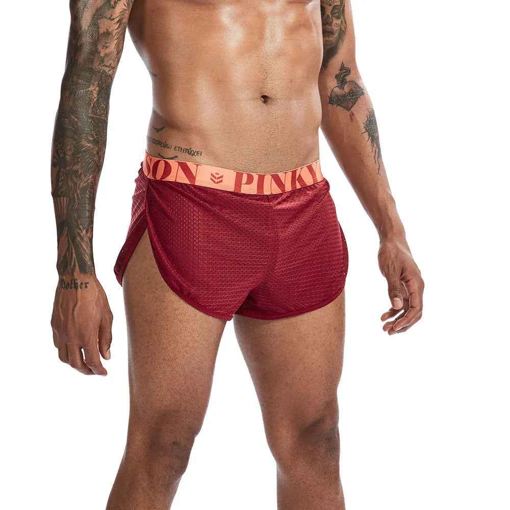 Men's solid colour mesh boxer briefs on a mid-waist fit model.