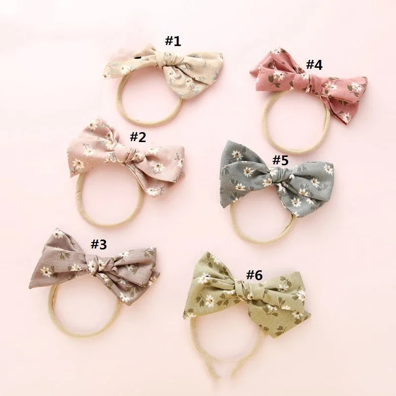 Children's cloth knotted bow hair ring in a Snow White princess print.