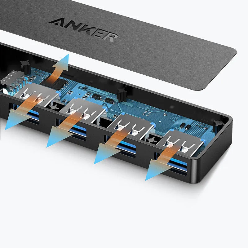 Black Anker USB 3.0 hub with four ports and a 20cm cable on a desk.
