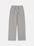 Men's black fleece-lined drawstring sweatpants with an elastic waistband, shown in a loose fit.