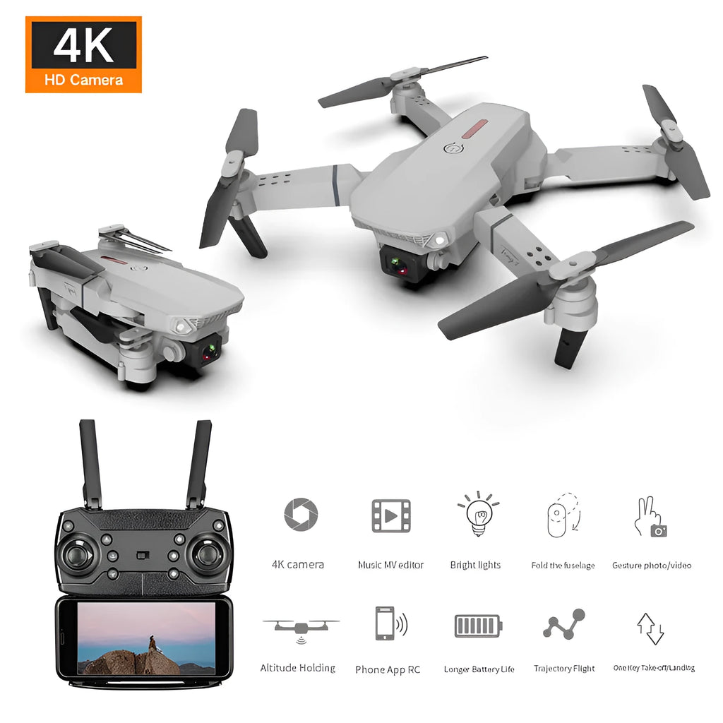 Grey foldable 4K aerial drone with dual cameras and remote control on a grassy field.