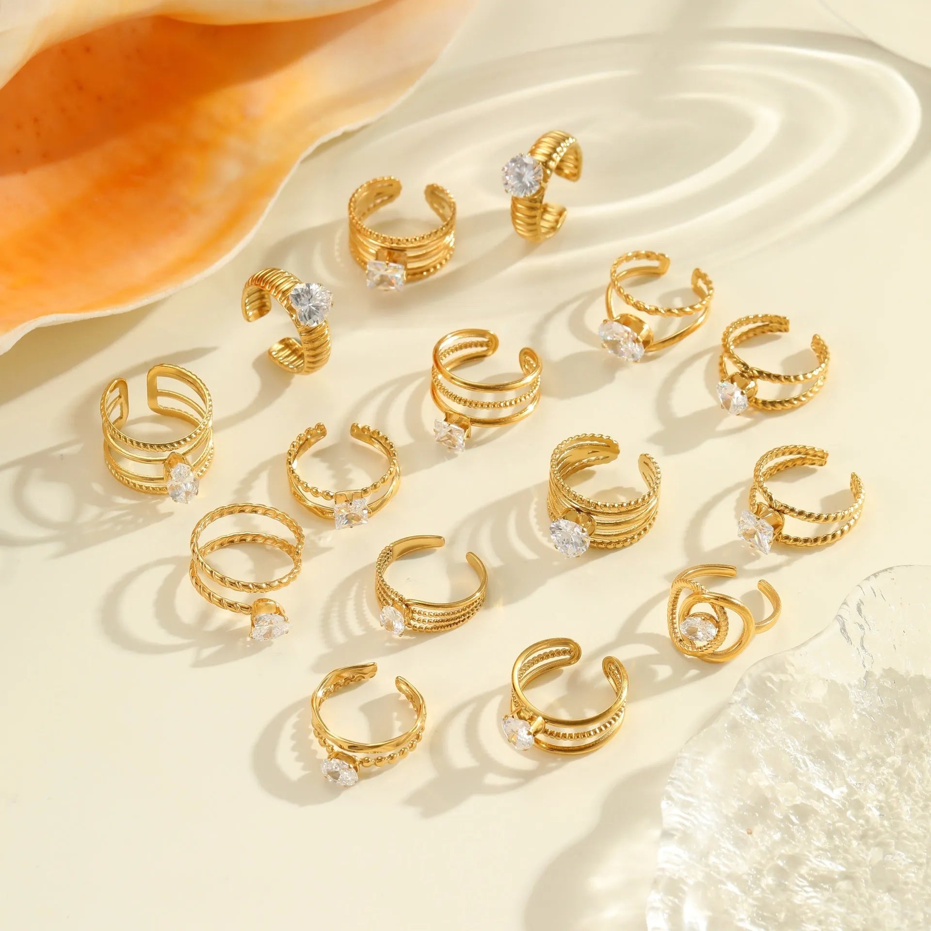 Gold coloured stainless steel ring with geometric and heart shapes, open mouth adjustable design.