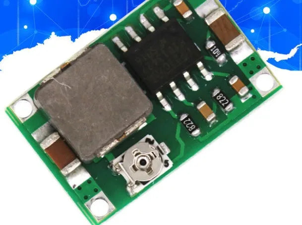 Mini 360 green DC-DC buck converter step down power module on a white background