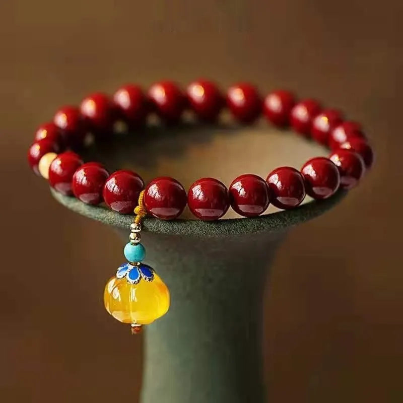 Gold cinnabar wave bracelet with solid copper beads in handcrafted national style design
