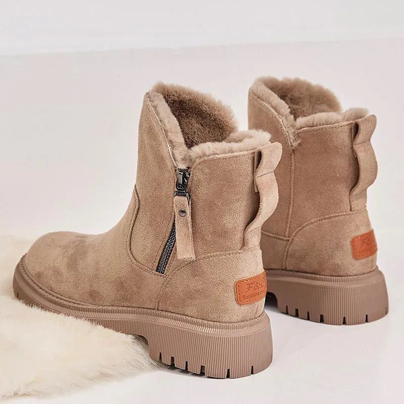 Women's black snow boots with high-top design, side zipper, and non-slip rubber sole for winter