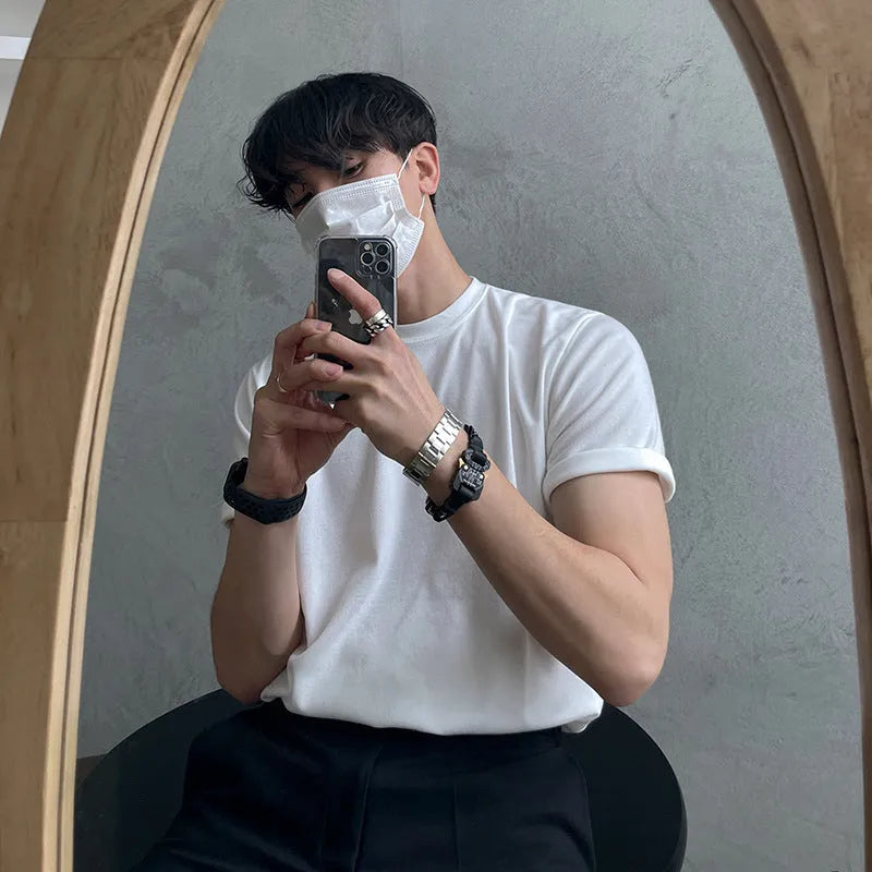 Men's slim fit cotton t-shirt in black or white with half-sleeve round neck design on hanger