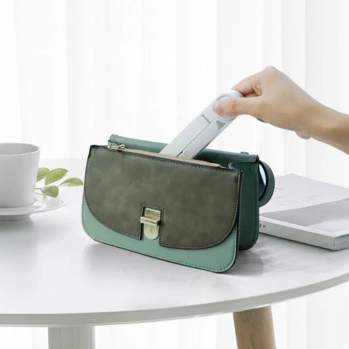 Foldable tablet holder in black showing multi-angle adjustment and non-slip rubber surface for device support