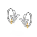 XINGX geometric cross earrings with 1.5cm round element in electroplated white gold colour on 925 silver