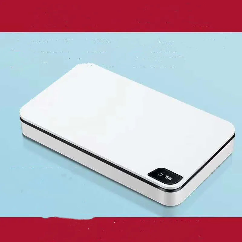White multifunctional wireless phone charger and UV air steriliser unit with remote control.