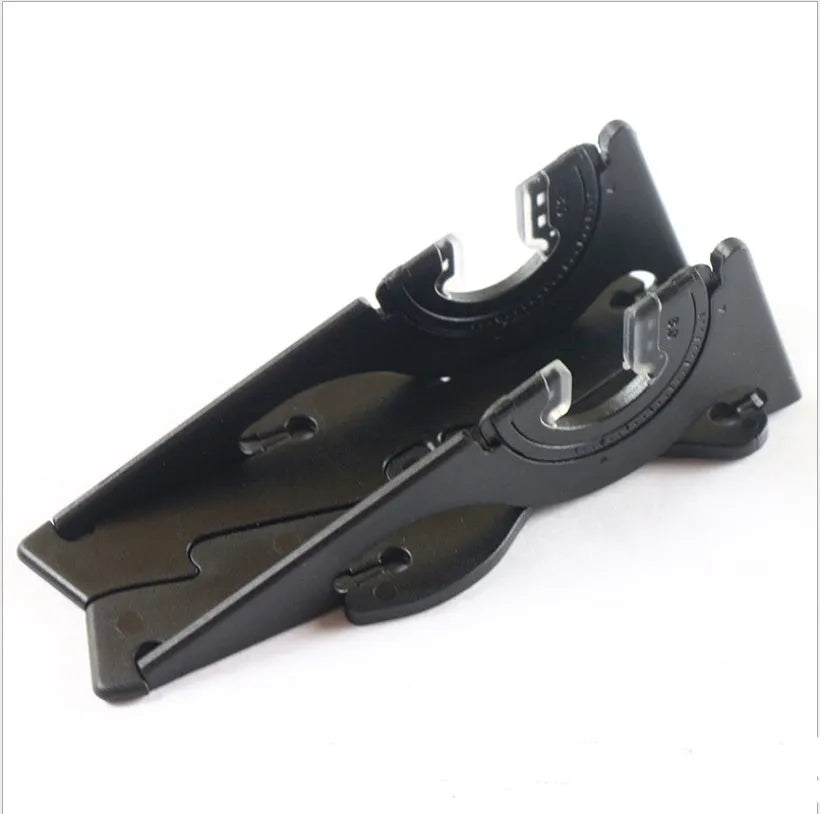 Black card type mobile phone holder on desk, holding smartphone at adjustable angle