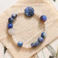 Hand-woven natural stone bracelet with blue point stone and black hair crystal agate in geometric design