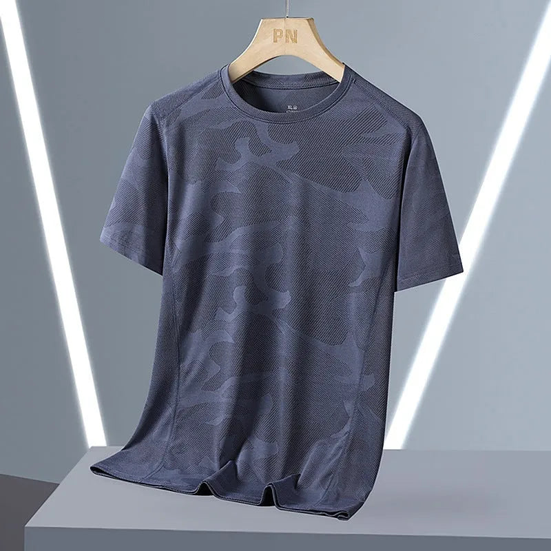 Men's loose fit camouflage short sleeve summer top in quick-drying nylon fabric.