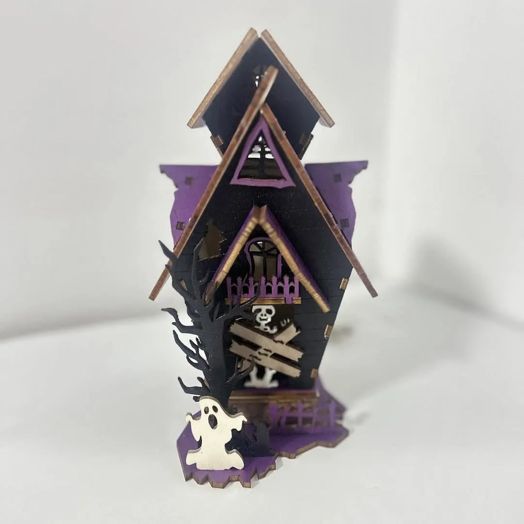 Wooden haunted house Halloween decoration measuring 14x10.5x19cm with luminous finish and cut-out details