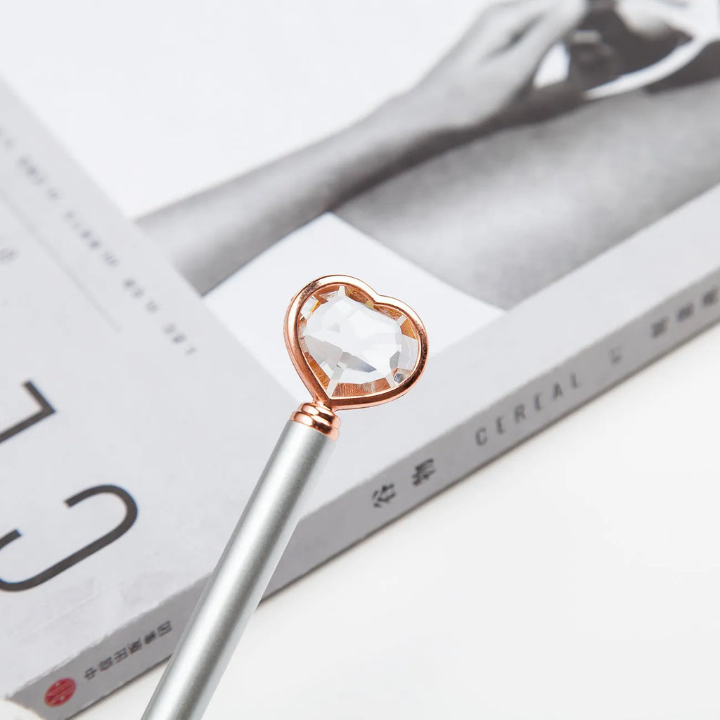 Golden Love Ball Crystal Diamond Metal Pen on a white background.