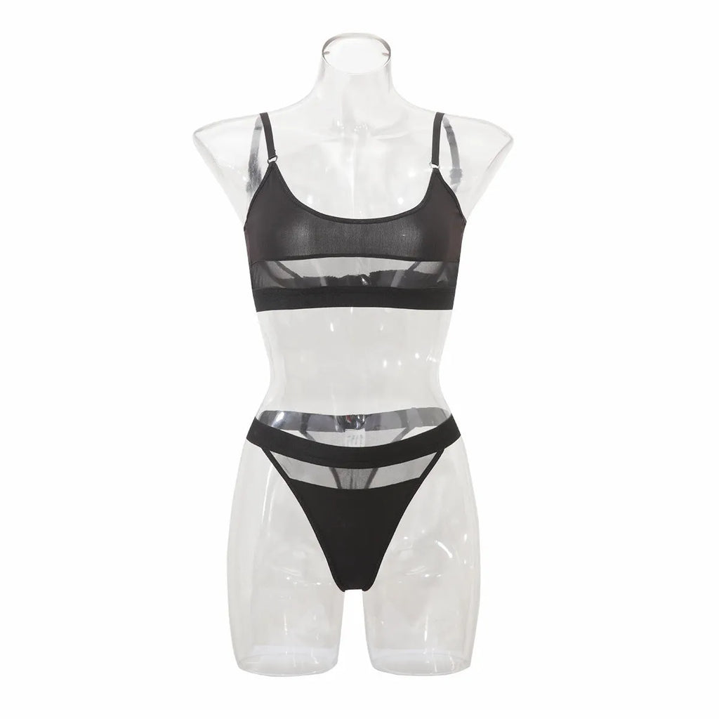 Women's black full cup bra and panty set with adjustable straps on a white background.