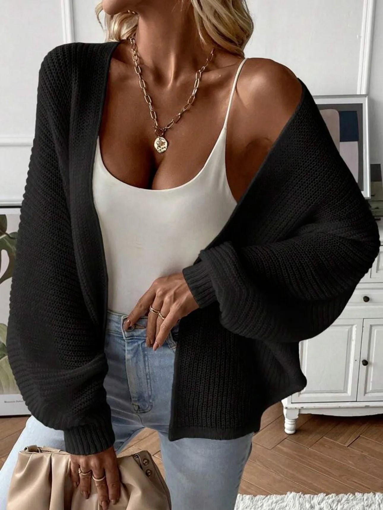 Women's loose fit batwing sleeve cardigan in solid colour, shown on a hanger.