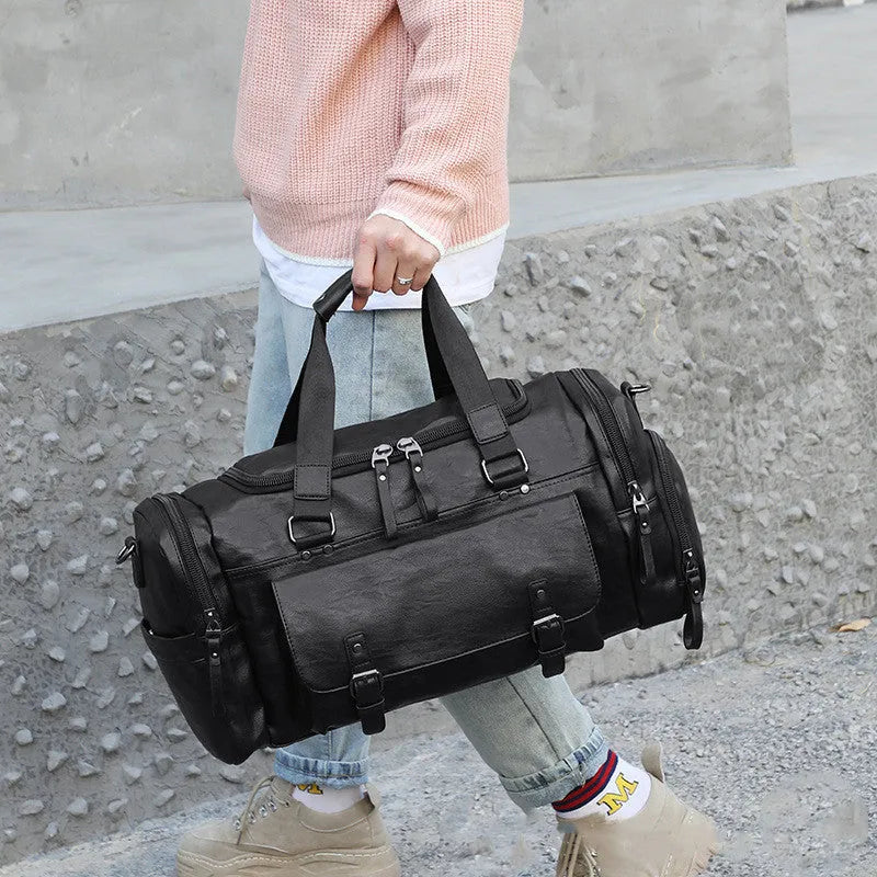 Black travel bag with shoe compartment measuring 52cm height, 19cm width, and 27cm depth