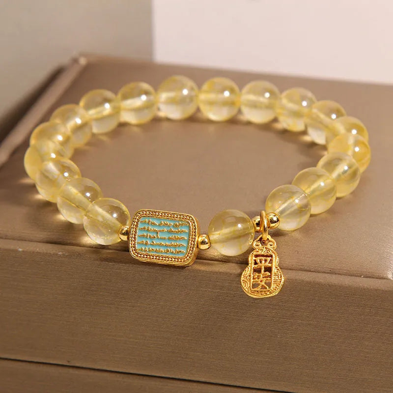 Yellow citrine crystal women's bracelet with rhinestone detailing on wrist