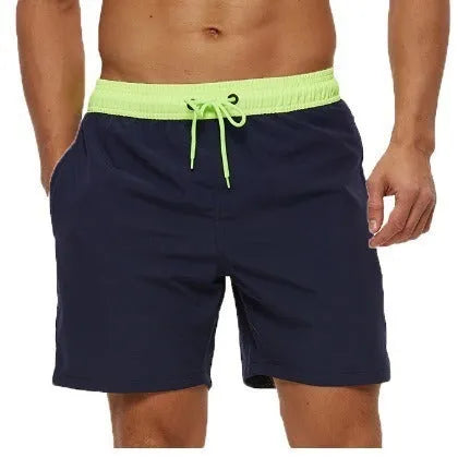 Men's blue athletic shorts with multiple pockets, drawstring waistband, and stitching detail for running and fitness activities