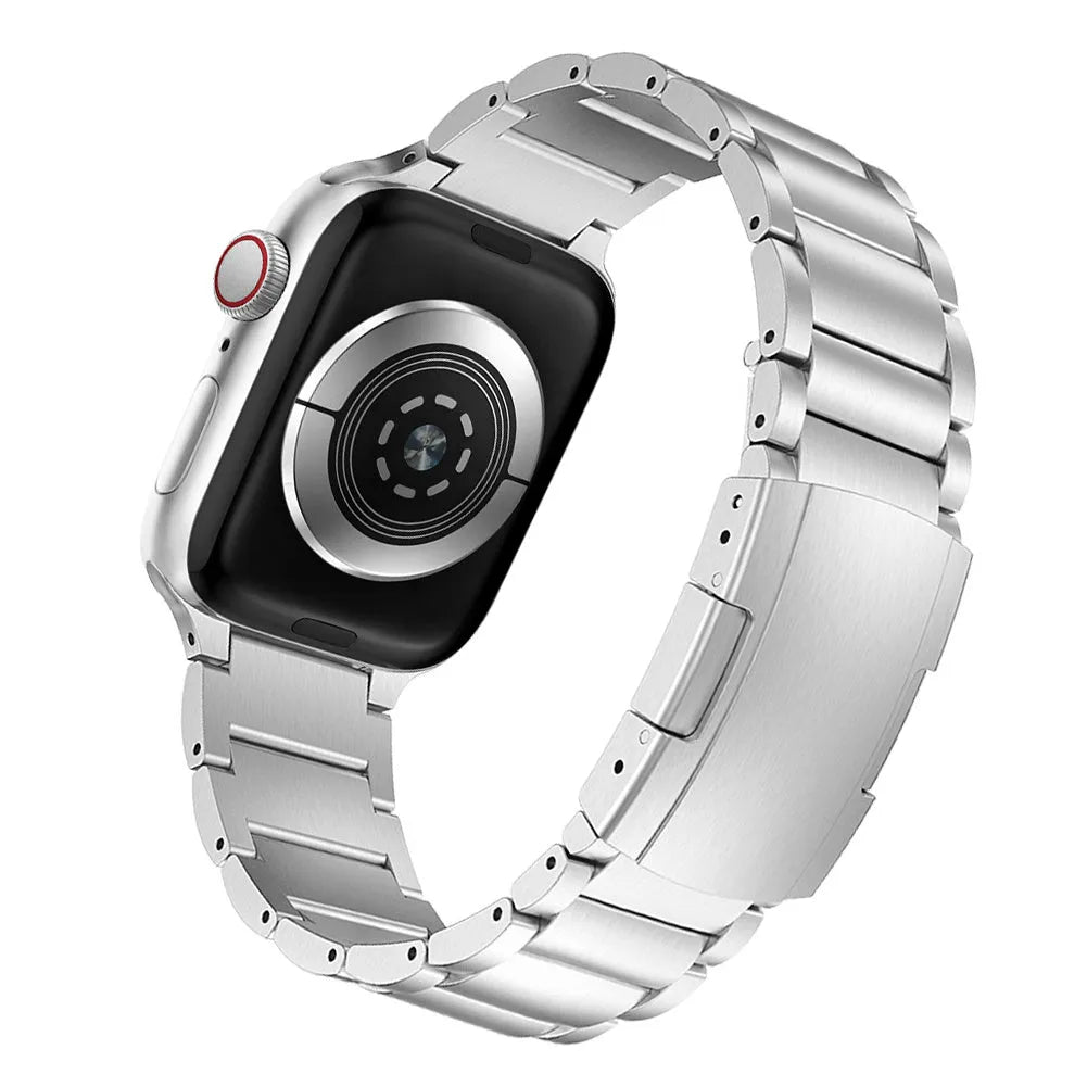 Black titanium alloy Apple Watch replacement strap with folding buckle on a wrist
