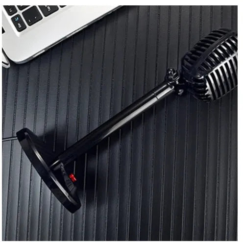 Black USB computer microphone with adjustable gooseneck on a weighted stand.