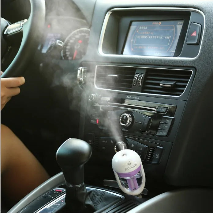 Compact car humidifier with 180-degree rotation nozzle in blue colour, showing ≤380ml/h capacity and 5W power specifications