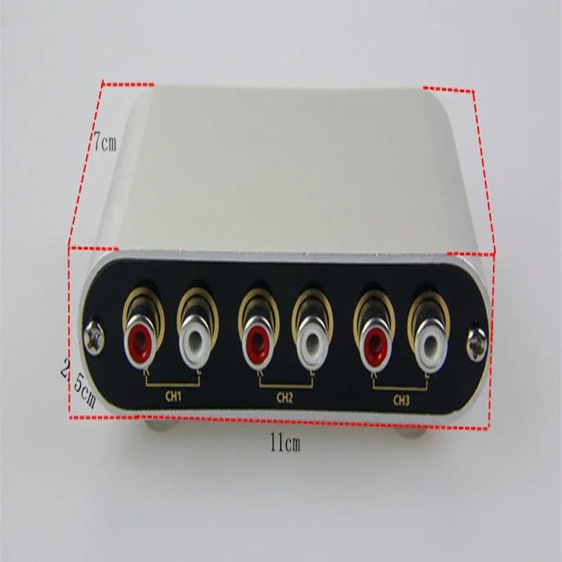 Silver aluminium alloy audio source switcher unit with front-panel switch button and infrared remote control.