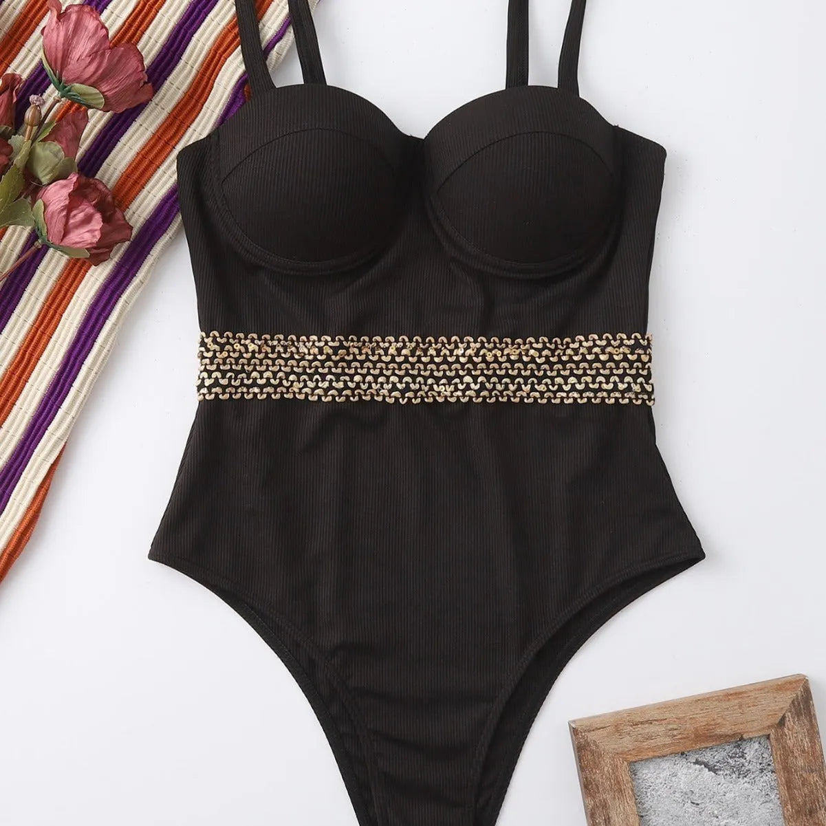 Black one-piece swimsuit with adjustable shoulder straps for women in polyester fabric