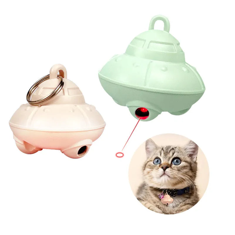 Small green plastic automatic laser toy attached to a cat collar for hands-free interactive pet play.