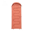 Ochre and olive green cotton sleeping bag with 300g/m² fill, packed to 40cm x 20cm for camping