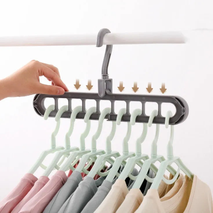 Plastic storage hanger with rotating handle in pink or green, 33 cm long, for heavy clothing