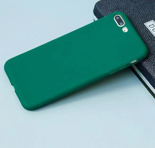 Frosted matte soft-shell iPhone case in multiple colours, shown fitting an iPhone.