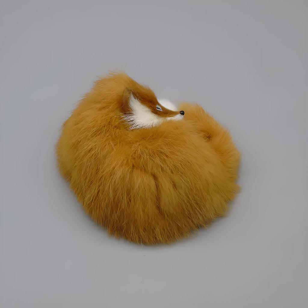 Small white artificial fox fur ornament for car or home decoration.