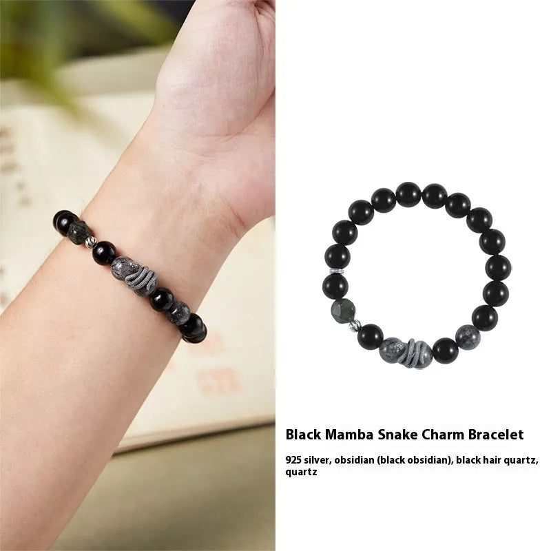 Men's retro snake bracelet in sterling silver with a large black obsidian stone on a dark background.