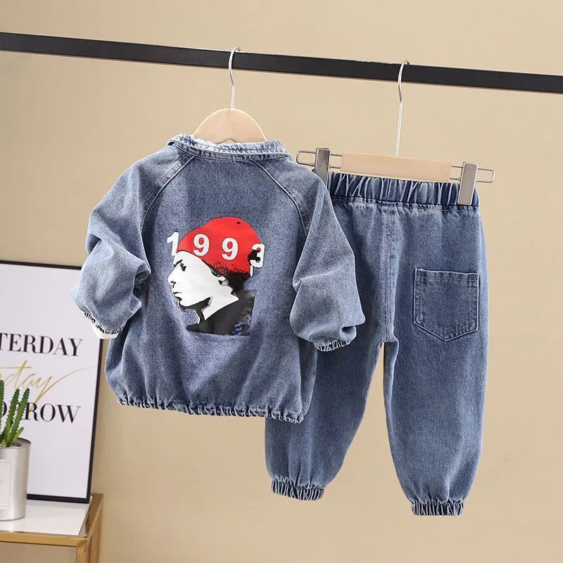 Boys' blue denim two-piece suit set with long sleeves, showing top and trousers laid flat.