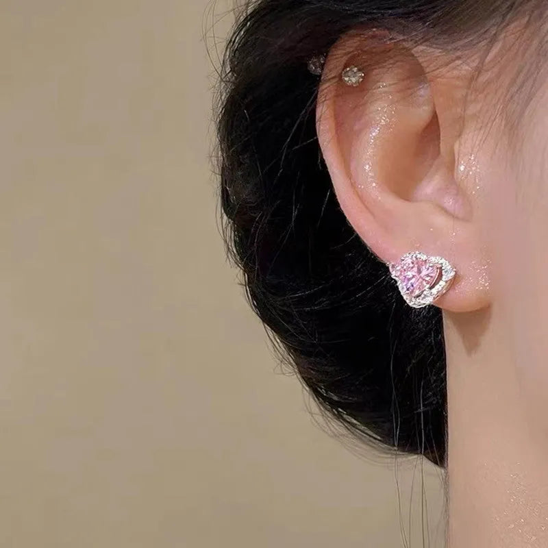 Women's white gold tone heart stud earrings with electroplated copper construction
