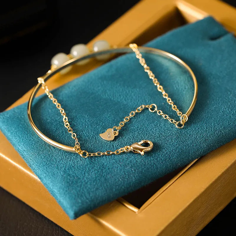 Hetian jade bracelet with gold-inlay treatment in single, double, or three-bead versions for women