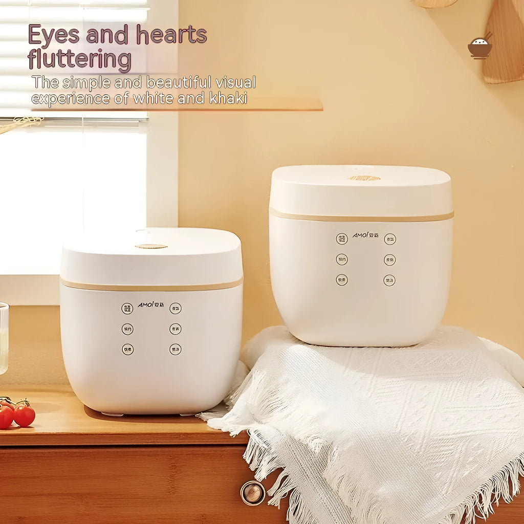 White and beige plastic multi-function 3-litre rice cooker with black inner pot and accessories.