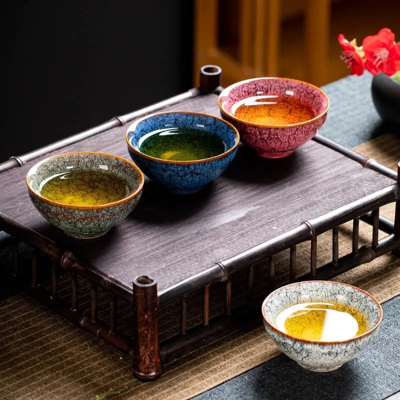 Four ceramic Gongfu tea cups in a light-coloured gift box, new Chinese style.