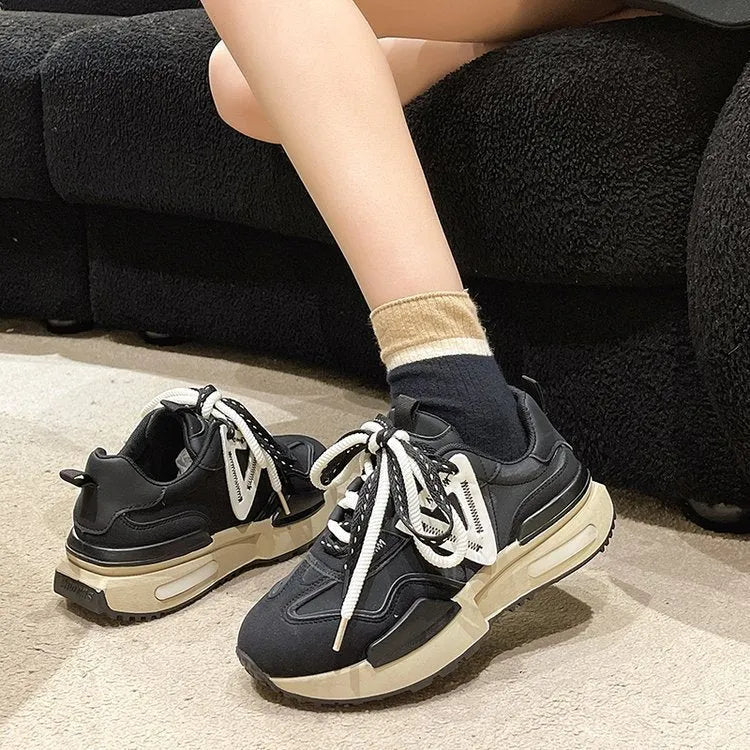 Women's black retro platform sports shoes with round toe and front lace-up design.